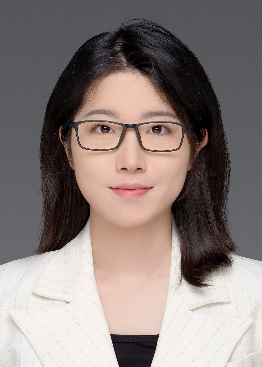 A person wearing glasses and a white jacketDescription automatically generated